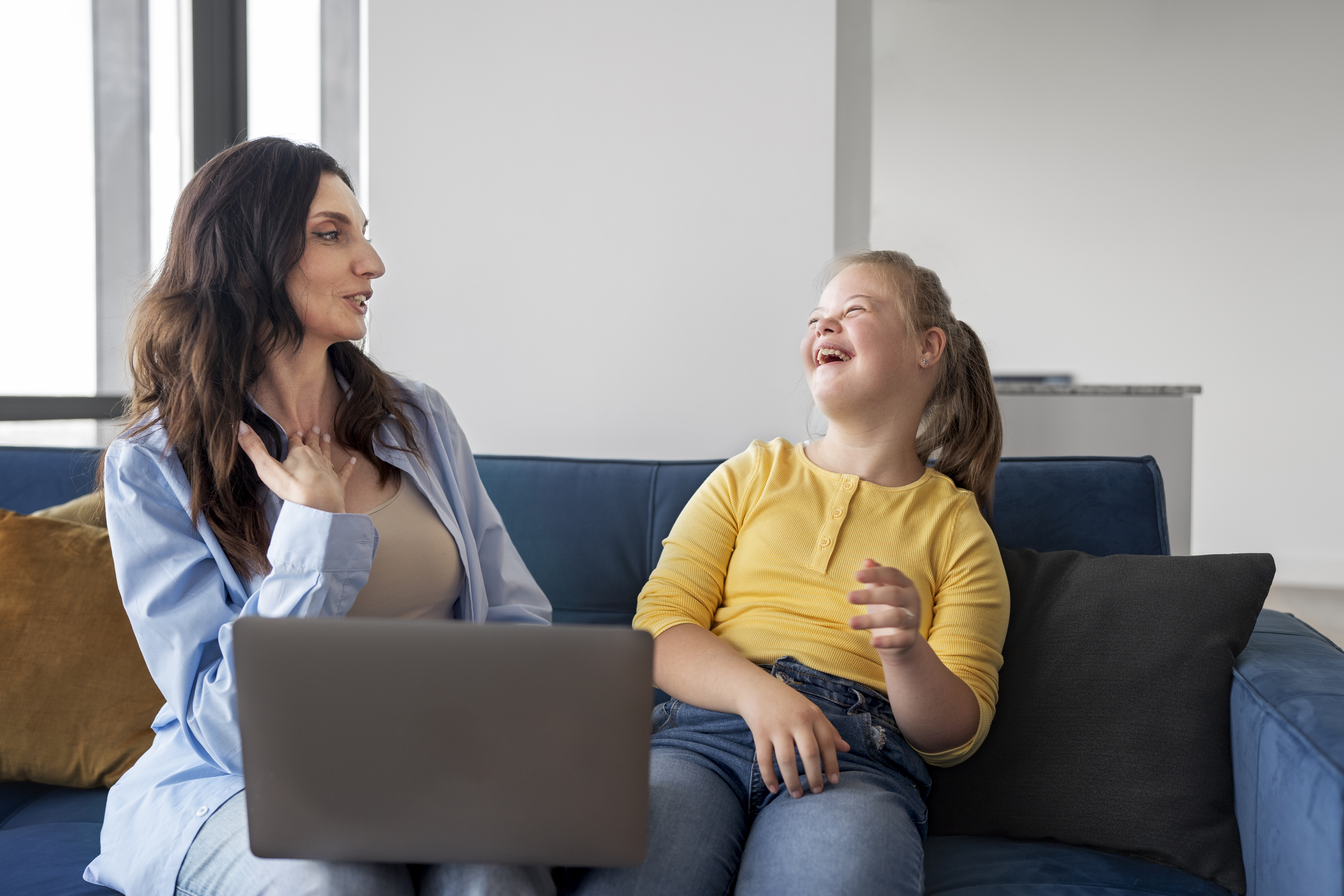 Support worker and participant sharing a genuine moment of connection during community activity